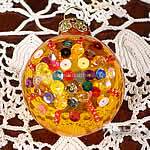 pallina gioiello dorata con paillettes