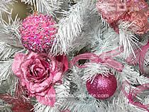 detail of flowers and balls ona white pine