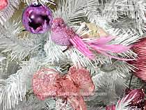 Detail of a bird on a Christmas tree, white colored