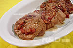 Pomegranade turkey, ready to be served sliced and garnished with pomegranade