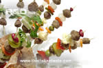Meatballs and vegetables on skewers