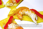 Polenta slices topped with prawns and bell peppers