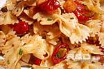 Mediterranean pasta salad with tomato confit, croutons, dried fruit and olives