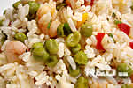Rice salad with shrimps, peas and bell peppers