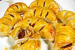 Puff pastry appetizers filled with baby octopus