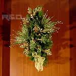 Pine branch with golden stuff for Holiday season door or wall